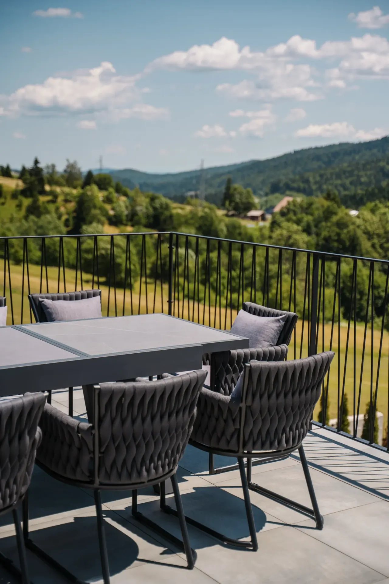 Terrace dining with a sweeping panorama of the hills